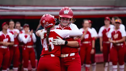 Jaclyn Showalter hugs Alivia Bark after a HR at Goodman Diamond.
