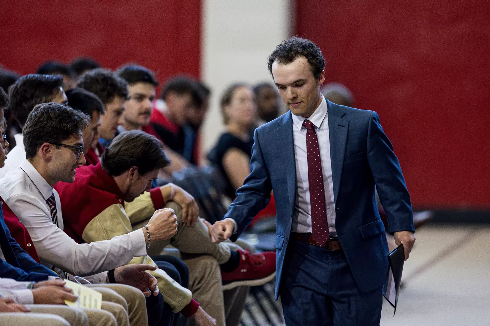 Liam Smith walks up to the stage to speak at the Class of 2026 Student-Athlete Graduation Ceremony