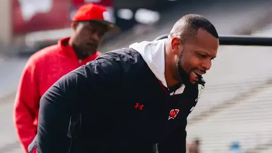 Running Backs Coach Jayden Everett coaches the Badgers during practice