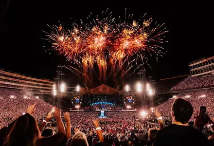 Coldplay playing at Camp Randall Stadium with fireworks in the air - Live at Wisconsin
