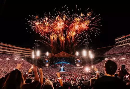 Coldplay playing at Camp Randall Stadium with fireworks in the air - Live at Wisconsin
