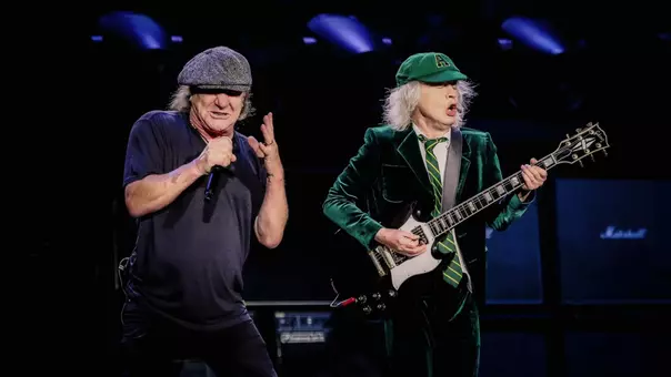 AC/DC singer Brian Johnson and Angus Young performing live
