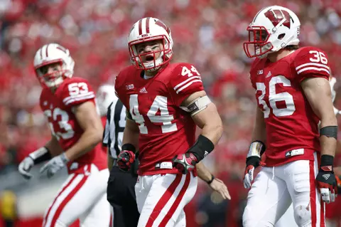 Chris Borland flexing after making a tackle vs UTEP