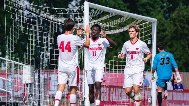 Men's soccer celebrates a goal against Oakland