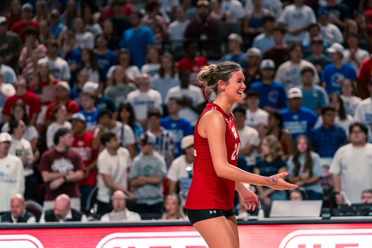 Wisconsin setter Charlie Fuerbringer (#24) smiles and reacts on court after a rally against Texas A&M.