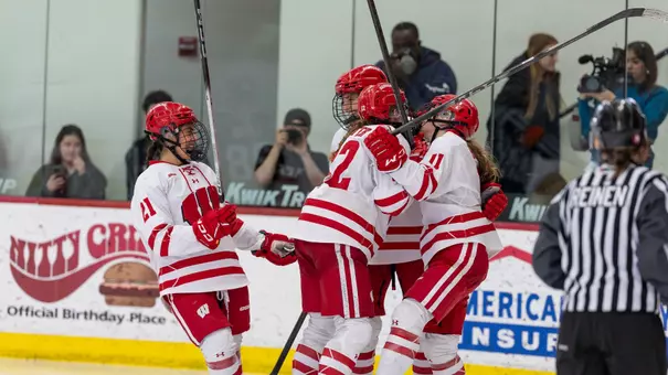 Women's hockey celebrates a goal against St. Cloud State