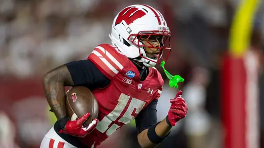 Wisconsin Badgers running back Nate Palmer (15) returns a kick during an NCAA college football game against Western Illinois Leathernecks, Sept. 12, 2026, in Madison, Wis. The Badgers won 36-9. (Photo by David Stluka/Wisconsin Athletic Communications)