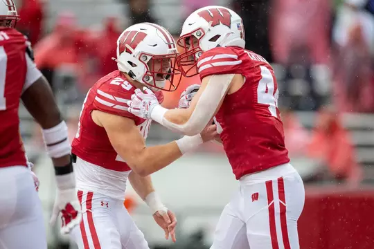 Matt Jung and Cooper Catalano celebrate a fumble recovery against Eastern Michigan