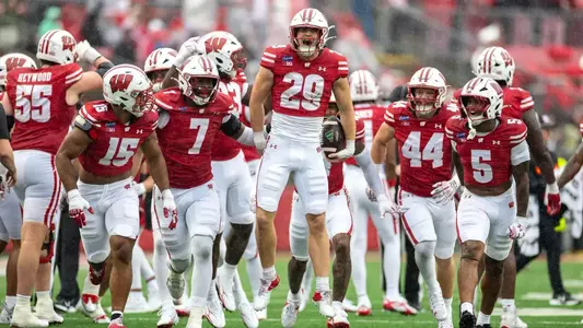 Wisconsin Badgers defensive back Matt Jung (29) celebrates an interception with teammates during an NCAA college football game against Eastern Michigan Eagles, Sept. 19, 2026, in Madison, Wis. The Badgers won 54-10. (Photo by David Stluka/Wisconsin Athletic Communications)
