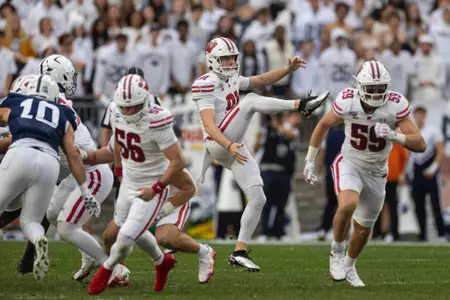 Sean West (91) punts against Penn State