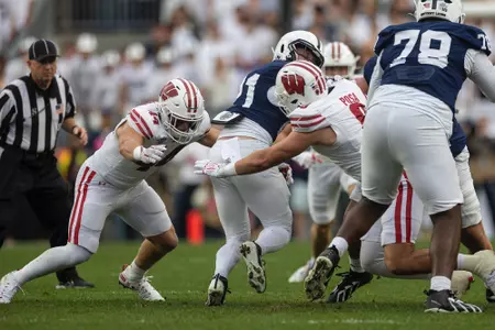 Cooper Catalano (44) and Mason Posa (8) combine for a tackle against Penn State