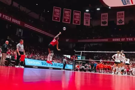 Lopez leaps into the air for the left-handed serve | Wisconsin Volleyball vs Florida