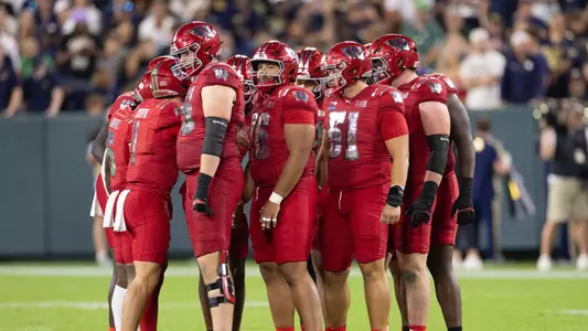 Wisconsin huddles during a 41-13 loss against Notre Dame at Lambeau Field on Sept. 6, 2026.