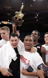 Justin Gray holds up the MVP trophy as he his joined by Richard Joyce and other teammates after defeating Arizona to win the NIT.