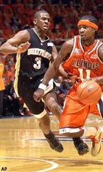 Chris Paul defends Illinois' Dee Brown during first half action.