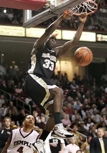 Temple's Dion Dacons can only watch as Trent Strickland dunks during the second half.