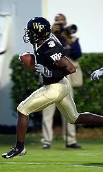 Marcus McGruder scores a touchdown in the first half.