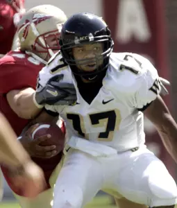 Wake Forest quarterback Cory Randolph, right, scrambles for second-quarter yardage as Florida State's Anthony Kelly, left, attempts to make the tackle, Saturday, Oct. 8, 2005, in Tallahassee, Fla.(AP Photo/Phil Coale)