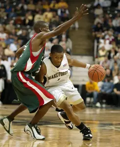 Justin Gray drives past Mississippi Valley State's Mike Thomas during the 1st half of the 2K Sports College Hoops Classic at the Lawrence Joel Coliseum.