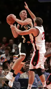 Wake Forest's Kyle Visser, left, grabs a rebound from Texas Tech's Jonathan Plefka during Wake Forest's double overtime win on Friday night. (AP Photo)