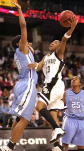Cotelia Bond-Young drives to the basket by North Carolina's Nikita Bell during the second half.