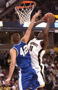 Eric Williams drives the lane on Longwood's Chad Kosmon.