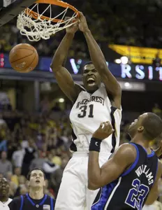 Eric Williams dunks over Duke's Shelden Williams during the first half.