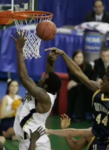 Eric Williams is fouled by Chattanooga forward Chris Brown in the first half.