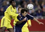 New England Revolution's Michael Parkhurst, right, battles Columbus Crew's Edson Buddie Saturday, April 9, 2005, at Gillette Stadium in Foxboro, Massachusetts.