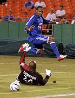 Scott Sealy slips the ball past Zach Thornton to score one his two goals in a 3-0 victory over the Chicago Fire on Aug. 19. (Eric Schlueter/MLS/WireImage.com)