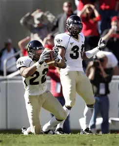 Josh Gattis (with ball) and Sam Swank were selected as the ACC's Defensive Back and Specialist of the week, respectively.