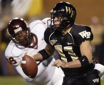 Riley Skinner runs away from Virginia Tech's Carlton Powell in the first quarter. (AP Photo/Nell Redmond)