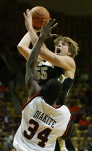 Kyle Visser shoots over Virginia Tech's Cheick Diakite during the first half. (AP Photo/The Roanoke Times, Matt Gentry)