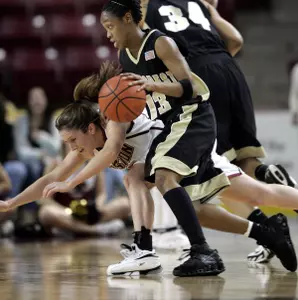 Boston College Sarah Marshall, left, loses her balance while she tries to get a ball from Cotelisa Bond-Young during the first half. (AP Photo/Chitose Suzuki)