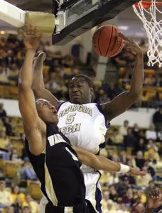 Wake Forest's Justin Gray (1) is fouled by Georgia Tech's Mario West (5) during second half of college basketball action Saturday, Feb. 25, 2006 in Atlanta. Tech won 76-61. (AP Photo/John Bazemore)