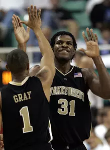 Wake Forest's Eric Williams (31) and Justin Gray celebrate in the second half against North Carolina State during a quarterfinal Atlantic Coast Conference basketball tournament game Friday, March 10, 2006, in Greensboro, N.C. (AP Photo/Chuck Burton)
