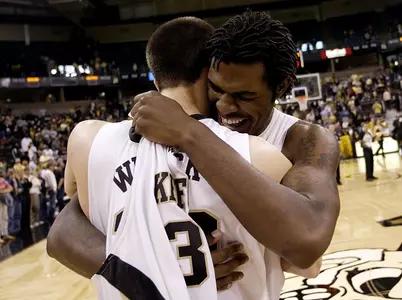 Wake Forest senior Eric Williams, right, shares a hug with fellow senior John Buck, left, on the court after a win in the last home game of their college careers. (AP Photo/Chris Keane)