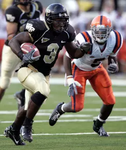 Micah Andrews ran for 142 yards against the Orange Saturday. (AP Photo/Chuck Burton)