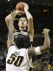 Wake Forest's Chas McFarland shoots over Iowa's Jarryd Cole during the second half.
