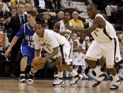 Wake Forest's Jeff Teague (0) leads a fast break after a steal as Air Force's Tim Anderson (12) watches