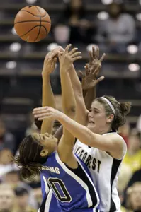 Wake Forest's Corinne Groves, right, loses the ball as she is trapped by Duke's Lindsey Harding, left, during the first half of a college basketball game in Winston-Salem, N.C., Sunday, Feb. 11, 2007. (AP Photo/Chuck Burton)