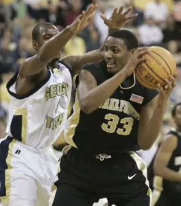 Wake Forest guard Anthony Gurley keeps the ball from Georgia Tech guard Mario West in the first half. (AP Photo/John Amis)
