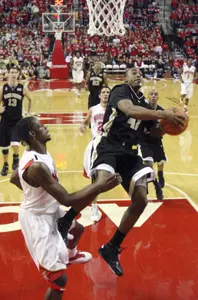 Maryland's James Gist guards L.D. Williams as he puts up a shot up during the first half.