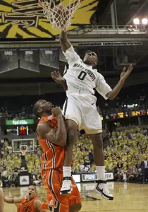 Jeff Teague dunks over Miami's Raymond Hicks during the second half.