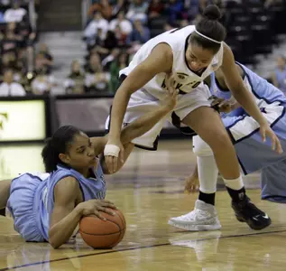North Carolina's Italee Lucas battles for posession with Courteney Morris. (AP Photo/Chuck Burton)