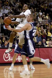 Jeff Teague drives to the hoop past Brigham Young's Ben Murdock. Teague scored 26 points for the Demon Deacons. (AP Photo/Winston-Salem Journal, Bruce Chapman)