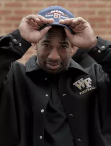 Aaron Curry shows off the Butkus Award hat.