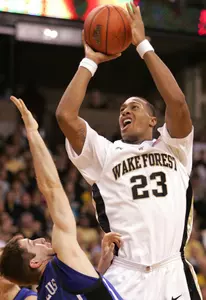 Wake Forest James Johnson shoots over Duke's Greg Paulus in first half (AP Photo)