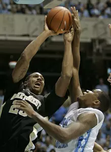 North Carolina's Deon Thompson guards James Johnson during the second half. (AP Photo/Gerry Broome)
