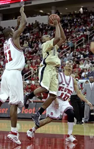Wake Forest's Jeff Teague (0) drives between North Carolina State's Gavin Grant (11) and Javier Gonzalez (10) during the first half (AP Photo)